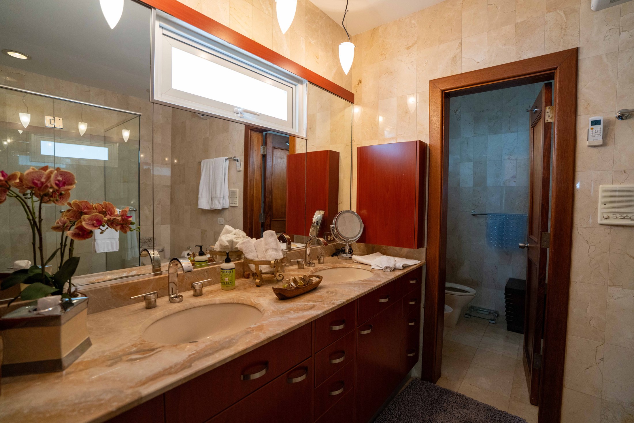 Master bathroom with double marble vanity and walk-in shower