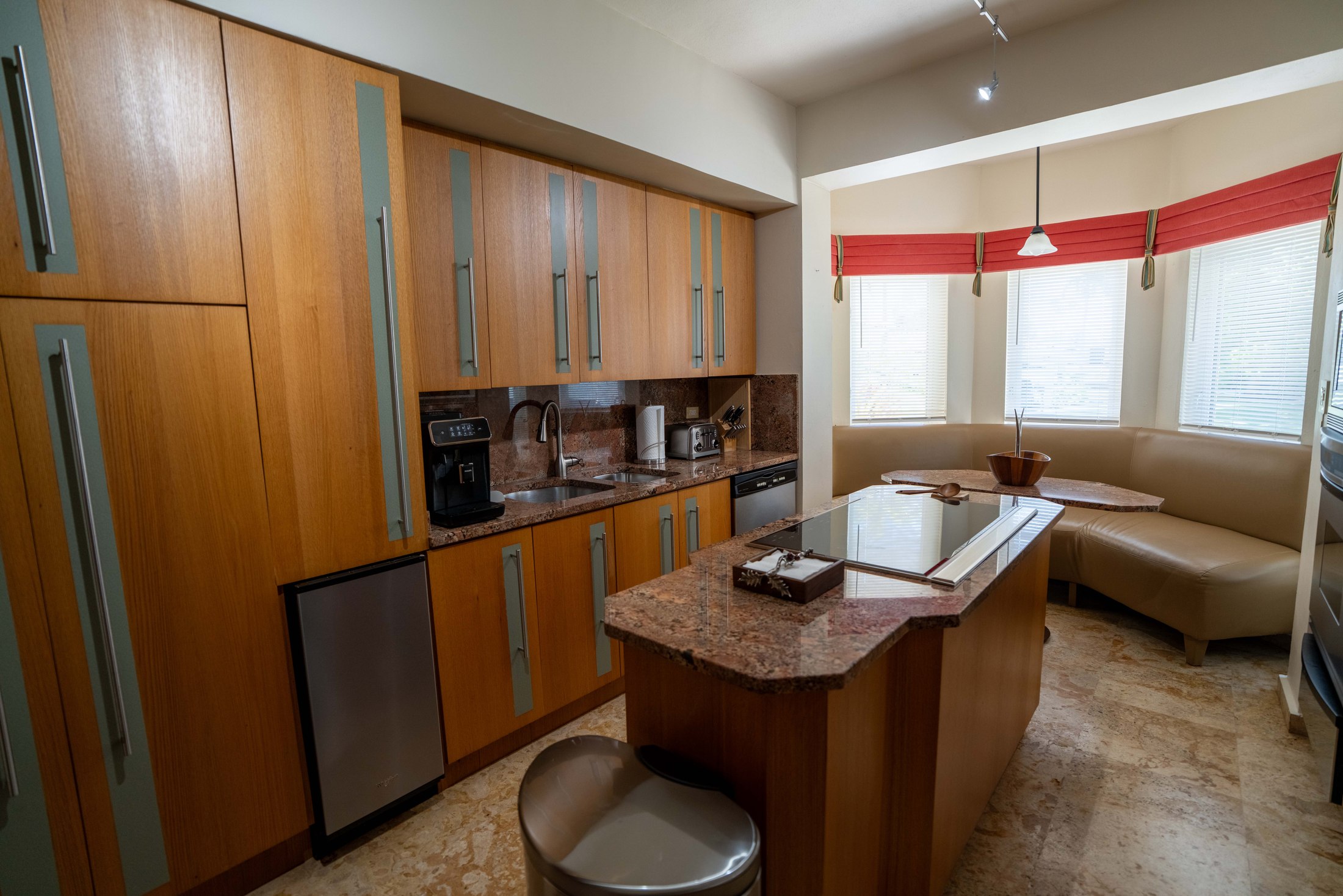 Kitchen with breakfast nook and wood cabinetry