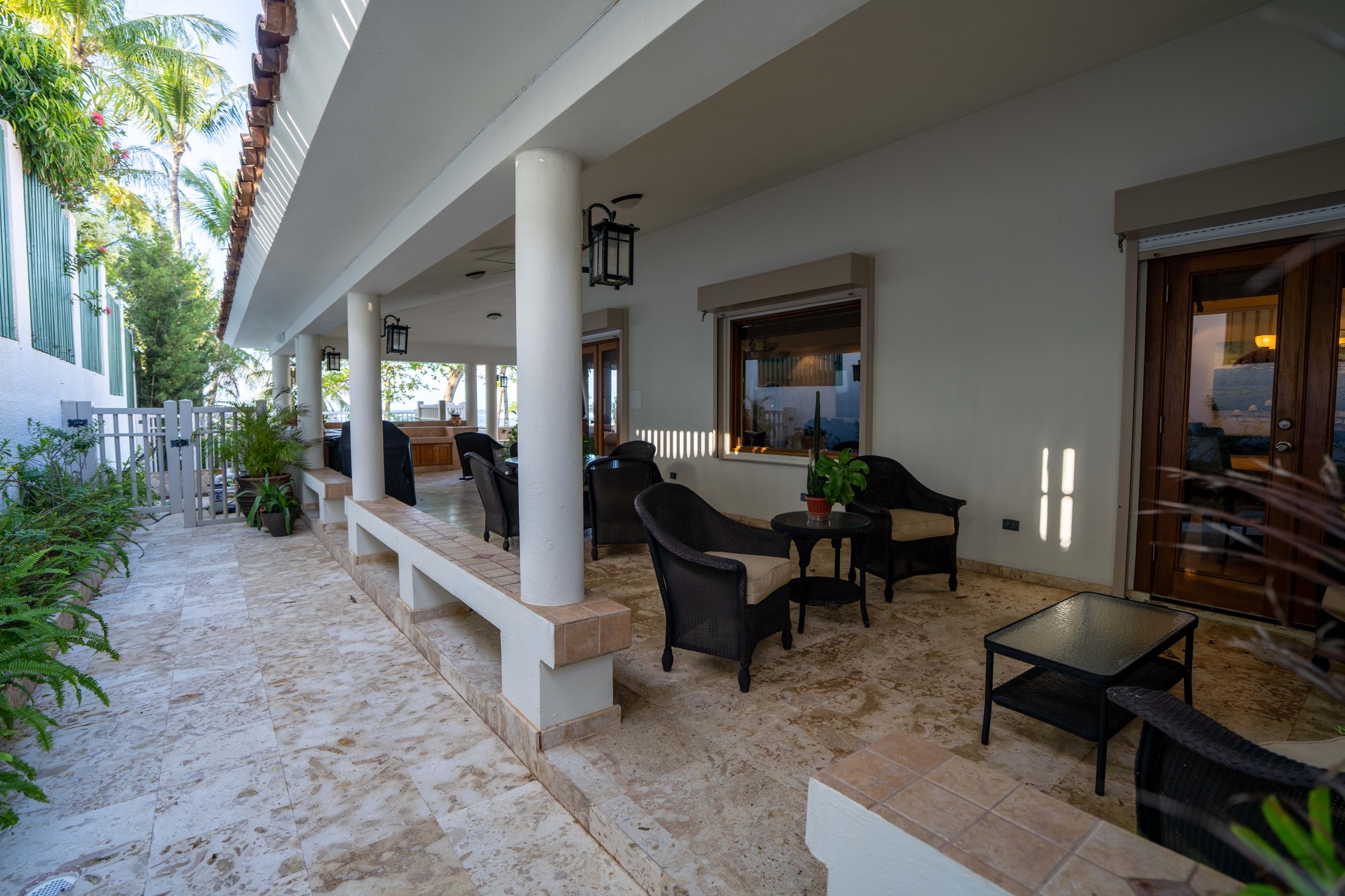 Covered wrap-around porch with lounge seating