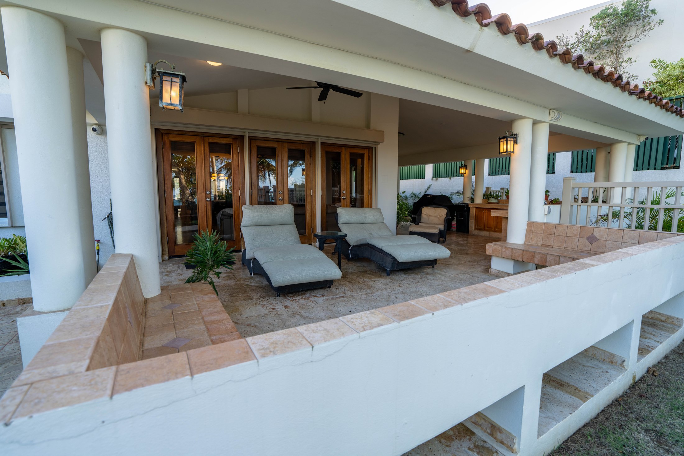 Shaded rear lounge deck with chaise loungers