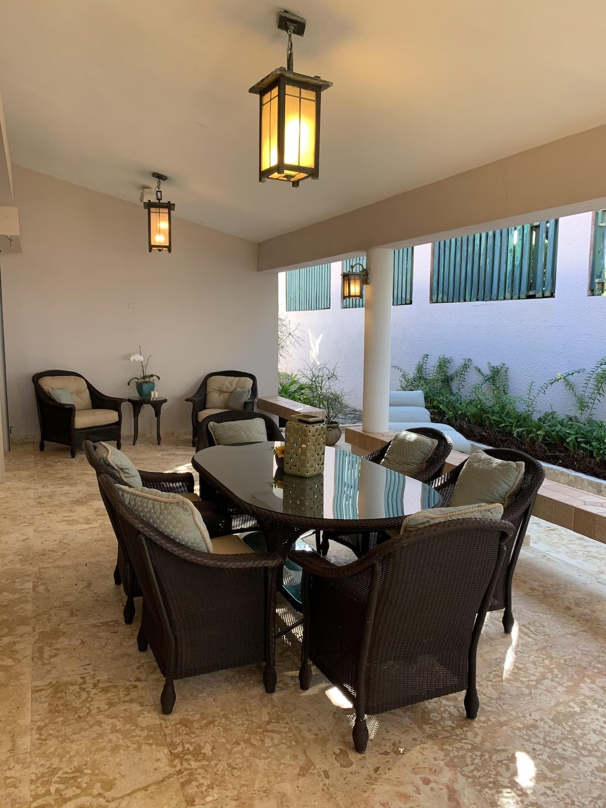 Covered patio dining area with lantern lighting